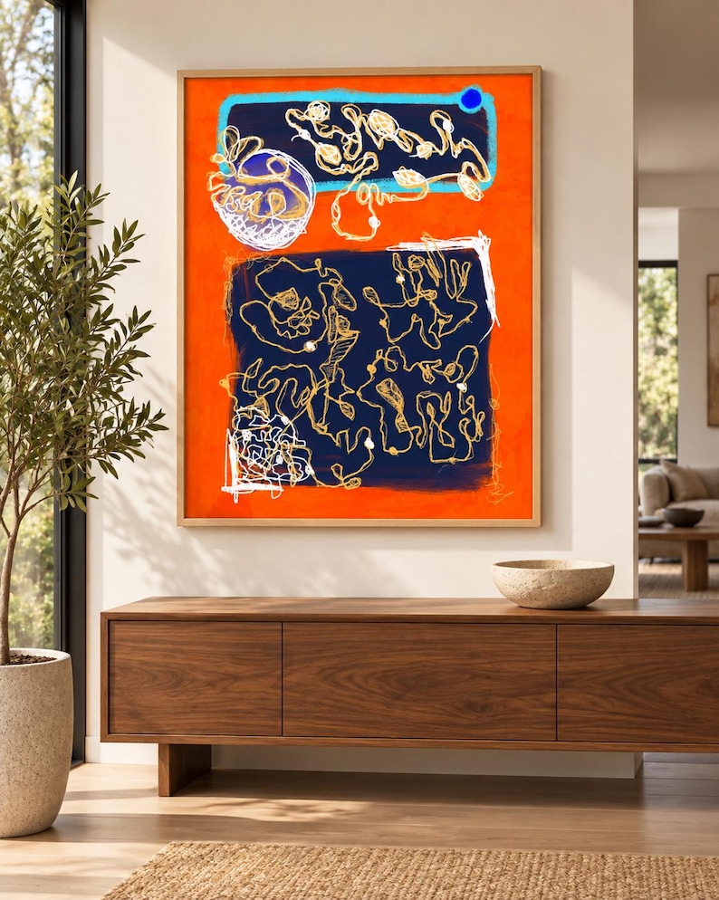 May include: A rectangular framed wall art piece featuring a vibrant orange background with two large dark blue rectangular sections. The artwork contains intricate white and gold line drawings, abstract shapes, and a small solid blue circle.