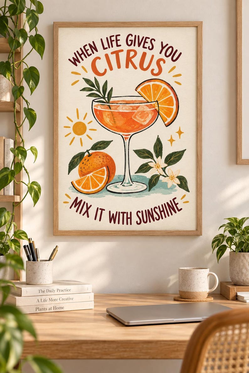 May include: A framed wall art print featuring a cocktail glass filled with orange liquid and ice, garnished with an orange slice. The text reads "WHEN LIFE GIVES YOU CITRUS MIX IT WITH SUNSHINE" alongside illustrations of a sun, oranges, and blossoms.
