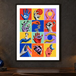 May include: A framed wall art print featuring a grid of twelve colorful collage panels. Each panel displays a hand interacting with various objects including a blue sky, a red flower, a yellow sun, white flowers, a checkered ribbon, a planet, a bust, an eye, a blue sphere, a rainbow, a torn paper edge, and a blue crescent moon.