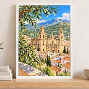 May include: A framed wall art print depicting a large stone cathedral with two towers, situated in a town with terracotta-roofed buildings, set against a backdrop of green hills and mountains under a bright blue sky with olive branches in the foreground.
