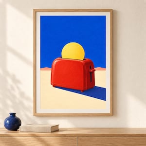 May include: A framed art print featuring a bright red toaster centered on a flat, beige desert landscape under a vibrant blue sky. A large, solid yellow circle rises from the toaster slot, resembling a sun against the deep blue background.