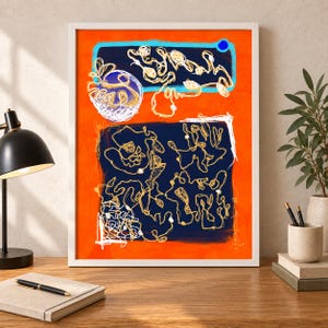 May include: A framed abstract art print featuring a vibrant orange background with two dark blue rectangular sections. The artwork displays intricate, thin, white and gold scribbled line patterns throughout, creating a complex, layered visual effect.