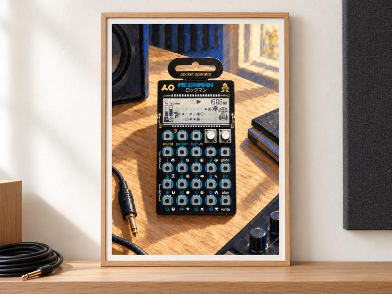 May include: A black Teenage Engineering Pocket Operator synthesizer featuring a Megaman Rockman graphic, a digital LCD screen, two silver rotary knobs, and a grid of sixteen blue-rimmed buttons with white labels, all framed in a light wood border.