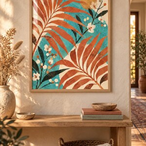 May include: A framed wall art print featuring large rust-colored palm leaves and delicate white flowers against a vibrant turquoise background. The composition includes a golden circular sun element and dark green foliage, all encased in a light wood frame.