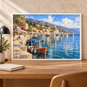 May include: A framed landscape painting depicting a Mediterranean coastal village with stone buildings, a harbor filled with blue and orange fishing boats, and a clear blue sky. The scene features a rocky shoreline, lush trees, and distant mountains.