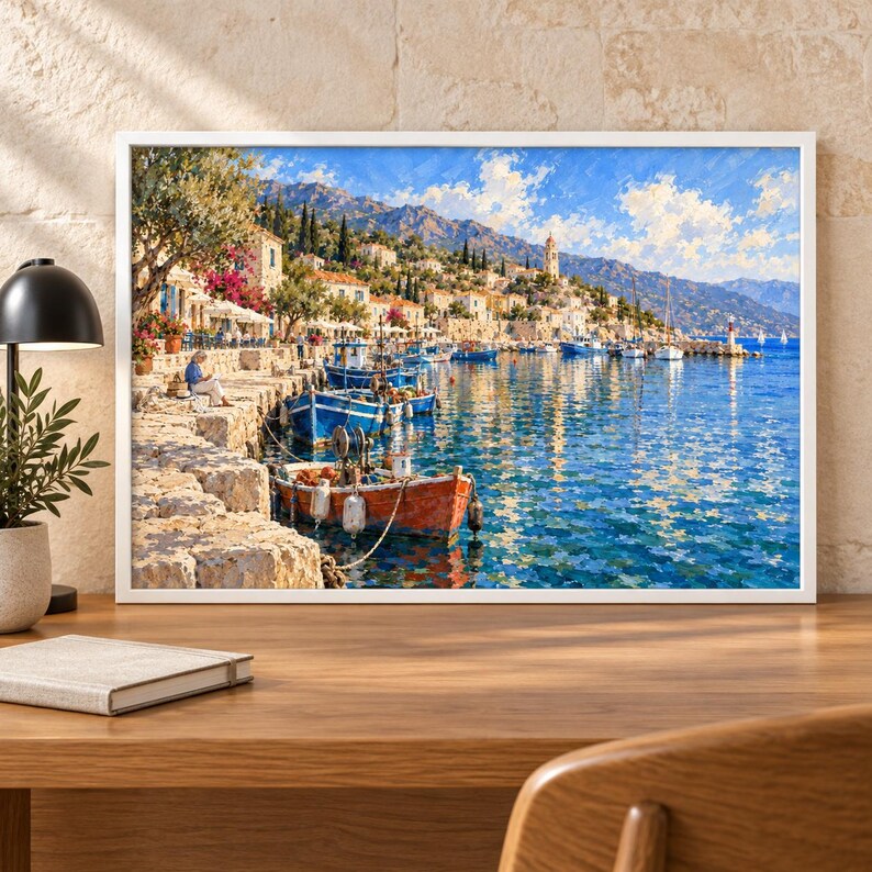 May include: A framed landscape painting depicting a Mediterranean coastal village with stone buildings, a harbor filled with blue and orange fishing boats, and a clear blue sky. The scene features a rocky shoreline, lush trees, and distant mountains.
