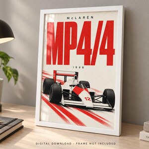 May include: A framed poster featuring a white and red McLaren MP4/4 Formula 1 race car from 1988. The artwork displays the text "MCLAREN" at the top, "MP4/4" in large red letters, and "1988" below, with red motion blur lines trailing behind the car.