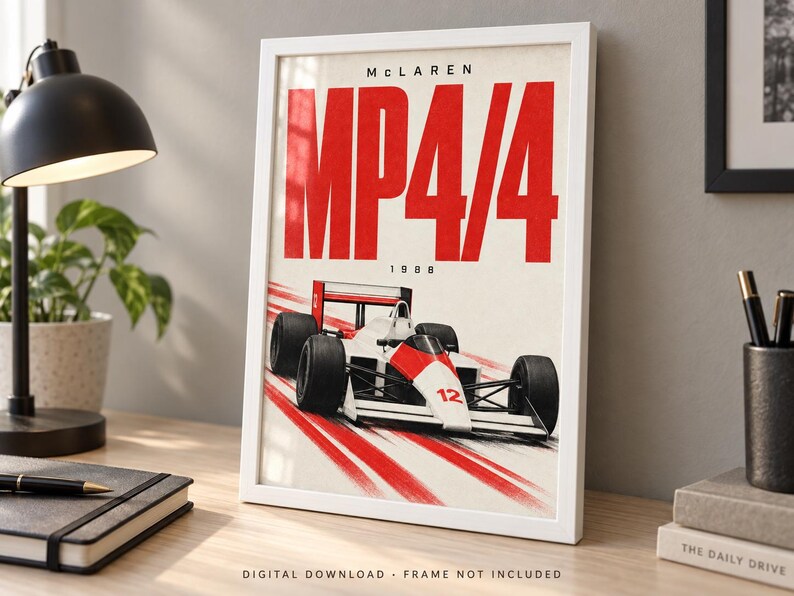 May include: A framed poster featuring a white and red McLaren MP4/4 Formula 1 race car from 1988. The artwork displays the text "MCLAREN" at the top, "MP4/4" in large red letters, and "1988" below, with red motion blur lines trailing behind the car.