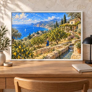 May include: A framed landscape painting depicting a Mediterranean coastal scene with a bright blue sea, sailboats, and a terraced lemon orchard. A person in blue trousers stands among the trees, while a stone water channel flows nearby.
