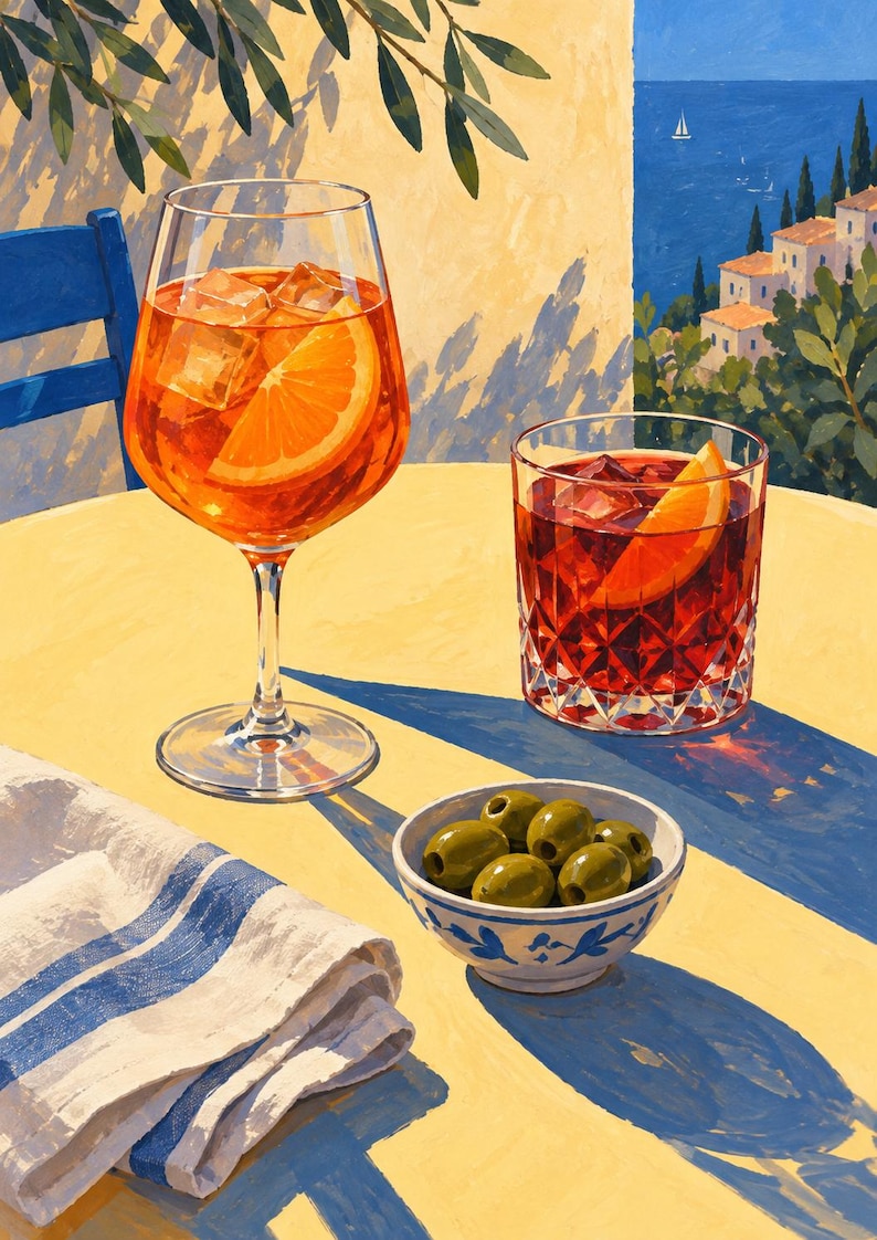 May include: An orange cocktail in a stemmed glass and a dark red cocktail in a crystal tumbler, both with orange slices and ice. A small white bowl with blue painted details contains green olives, next to a white napkin with blue stripes.