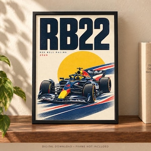 May include: A framed poster featuring a dark blue and yellow Red Bull Racing Formula One car, labeled RB22 and 2026, set against a large yellow sun and stylized red, white, and blue racing stripes on a cream background with bold dark blue text.