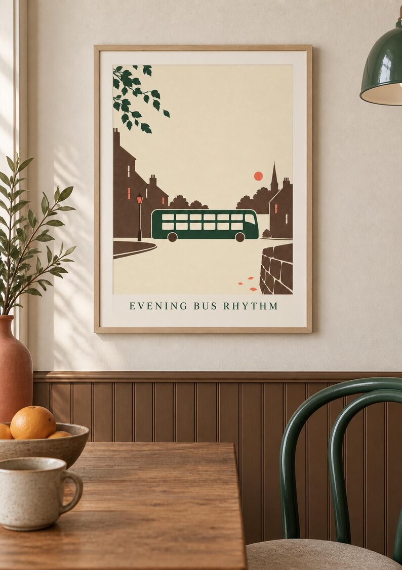May include: A framed wall art print featuring a stylized illustration of a dark green double-decker bus driving through a town at sunset. The scene includes brown silhouettes of buildings, a street lamp, and the text "EVENING BUS RHYTHM" at the bottom.