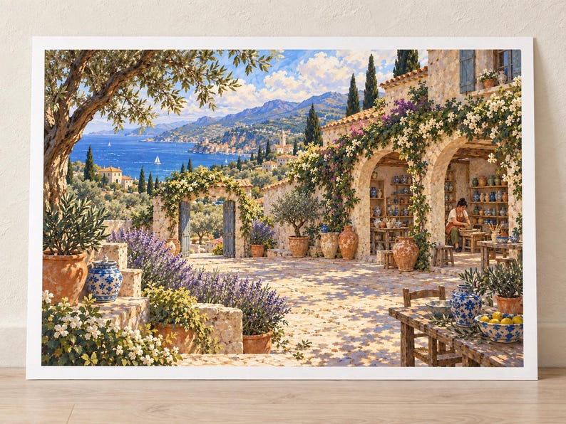 May include: A framed art print depicting a Mediterranean coastal scene with a stone villa, blooming white flowers, lavender bushes, and terracotta pots. A person works at a pottery wheel inside an arched patio, while a blue sea and mountains appear in the distance.