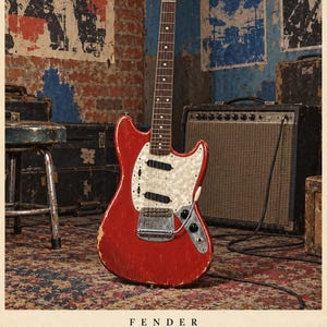 May include: A red Fender Mustang electric guitar with a white pearloid pickguard, a maple neck, and a rosewood fretboard. The body shows signs of wear with visible paint chips. The text FENDER Mustang 1964 is printed at the bottom.