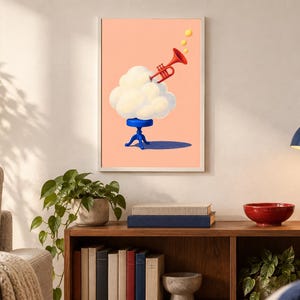 May include: A framed wall art print featuring a white cloud resting on a small blue stool against a peach background. A red trumpet emerges from the top of the cloud, with three yellow circular notes floating above the instrument's bell.