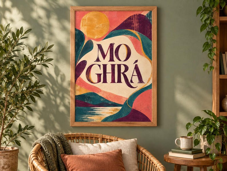 May include: A rectangular framed wall art print featuring a stylized landscape with a yellow sun, dark purple mountains, and teal hills. The text MO GHR&Aacute; is printed in large, dark purple serif letters in the center against a cream-colored background.
