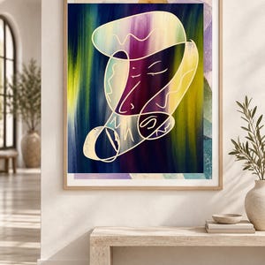 May include: A framed wall art print featuring an abstract composition with a central white line drawing of a face. The background consists of vertical brushstrokes in deep blue, purple, and yellow hues, enclosed within a light wood frame.