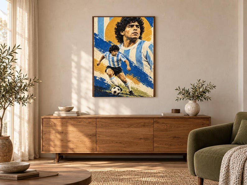 May include: A rectangular wall art print featuring a portrait and an action shot of Diego Maradona playing soccer. The artwork uses a color palette of blue, white, and yellow, depicting the athlete in a light blue and white striped jersey.