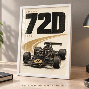 May include: A framed poster featuring a black and gold Lotus 72D Formula One race car with the number 8 on the front. The text LOTUS 72D and 1972 are printed in large black letters at the top. The car is depicted on a beige background with a curved track.