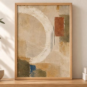 Puede incluir: Una l&aacute;mina de arte abstracto enmarcada que presenta una gran pincelada circular blanca, un bloque rectangular de color terracota y parches de verde oliva, amarillo mostaza y azul profundo sobre un fondo beige texturizado con tres l&iacute;neas negras.