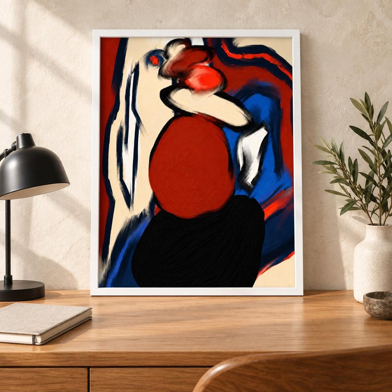 Pu&ograve; includere: Un dipinto astratto incorniciato caratterizzato da pennellate audaci ed espressive in rosso vibrante, blu intenso, nero e crema. La composizione mostra forme organiche arrotondate e linee fluide all'interno di una cornice bianca.