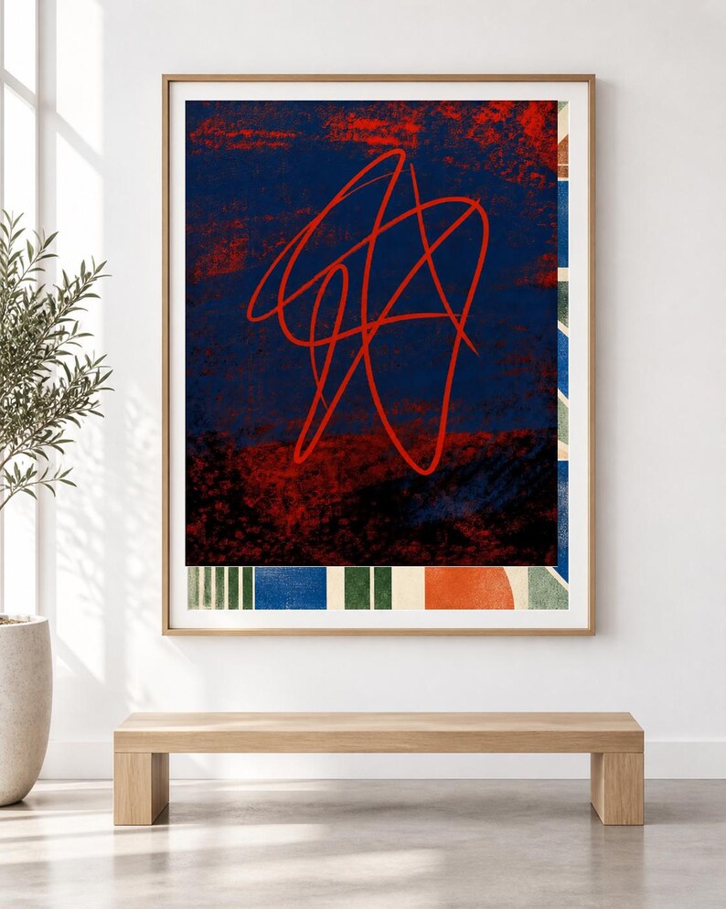 May include: A framed rectangular wall art piece featuring a dark blue background with a prominent red continuous line scribble. The bottom section displays a horizontal border of alternating vertical stripes in blue, green, and white, with a solid orange circle.