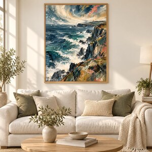 May include: A rectangular framed wall art print featuring an oil painting of a turbulent ocean coastline. The scene depicts dark blue and teal waves crashing against jagged, multi-colored cliffs under a dramatic, swirling sky with clouds.