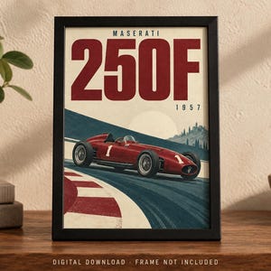 May include: A framed poster featuring a red Maserati 250F race car on a track. The text reads MASERATI 250F 1957. The car is marked with the number 1. The design includes a stylized landscape with a sun, hills, and a red and white curb.
