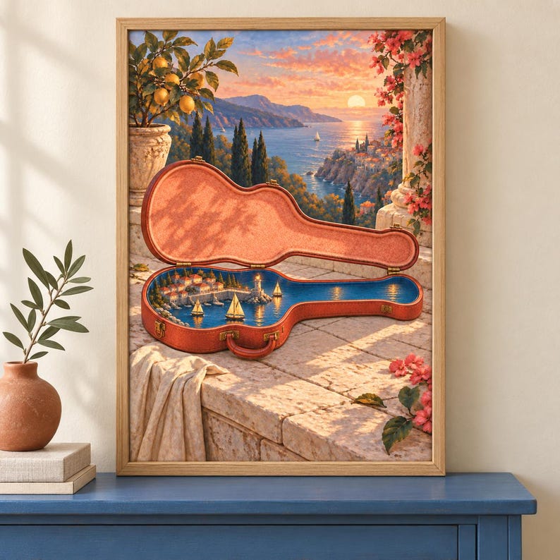 Puede incluir: Una l&aacute;mina de arte enmarcada que muestra un estuche de guitarra abierto sobre una terraza de piedra. Dentro del estuche, se ve una escena costera en miniatura con veleros y un faro. El fondo muestra una puesta de sol sobre el mar.