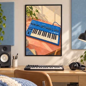 May include: A framed wall art print depicting a bright blue Roland SH-101 synthesizer with black keys and white keys, featuring numerous knobs and sliders on its control panel, displayed in a studio setting with plants and warm lighting.