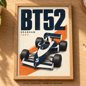 May include: A framed poster featuring a dark blue and white Brabham BT52 Formula One race car with the number 5 on the nose. The text BT52, Brabham, and 1983 are printed in dark blue and orange. The car is set against a diagonal orange stripe.