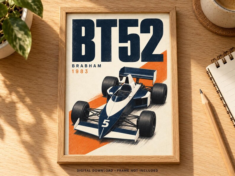 May include: A framed poster featuring a dark blue and white Brabham BT52 Formula One race car with the number 5 on the nose. The text BT52, Brabham, and 1983 are printed in dark blue and orange. The car is set against a diagonal orange stripe.