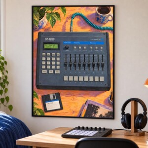 May include: A framed wall art print depicting a dark gray E-mu Systems SP-1200 sampler with a teal coiled cable, a digital display, multiple sliders, and a numeric keypad. A black floppy disk is positioned below the sampler on an orange surface.