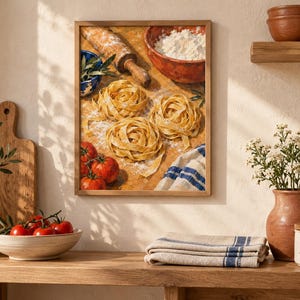 May include: A framed wall art print depicting a kitchen scene with three nests of fresh pasta, a wooden rolling pin, a bowl of white flour, red tomatoes, and a blue and white striped kitchen towel on a wooden surface with a warm light.
