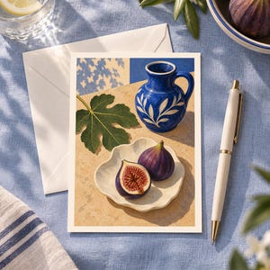 May include: A rectangular postcard featuring a still life illustration of a vibrant blue ceramic pitcher with white leaf patterns, a single green fig leaf, and two purple figs on a scalloped cream-colored plate, all set on a tan surface.