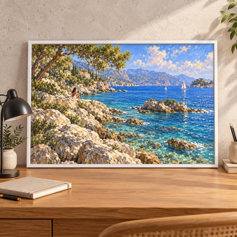May include: A framed landscape painting depicting a sunlit Mediterranean coastline with jagged light-colored rocks, deep blue water, and a distant mountain range. A small sailboat floats on the sea under a bright blue sky with white clouds.