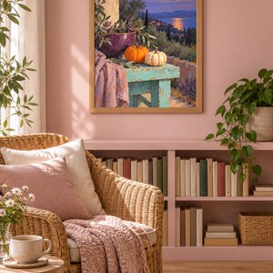 May include: A framed wall art print depicting a moonlit coastal landscape with a turquoise wooden table in the foreground. On the table sit a purple bowl with greenery, an orange pumpkin, a white pumpkin, and a draped lavender-colored fabric.