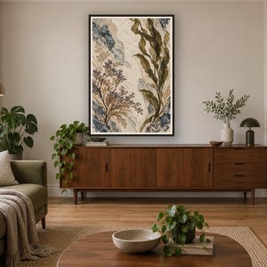 May include: A rectangular framed wall art piece featuring an abstract botanical composition with layered textures in shades of deep olive green, muted blue, and cream. The artwork displays stylized seaweed and floral elements.