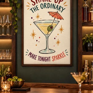 May include: A framed wall art print featuring a martini glass with an olive and a small red cocktail umbrella. The text reads SHAKE UP THE ORDINARY and MAKE TONIGHT SPARKLE, surrounded by orange starburst accents on a cream-colored background.
