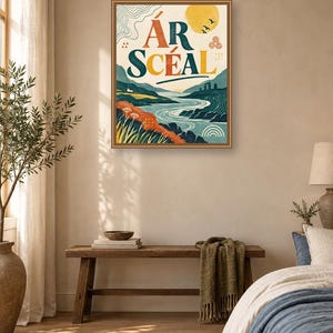 May include: A rectangular framed wall art print featuring a landscape illustration with a river, rolling hills, and a yellow sun. The text &Aacute;R SC&Eacute;AL is printed in large, bold letters at the top. The color palette includes shades of blue, orange, and yellow.