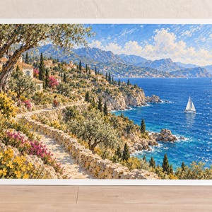 May include: A landscape art print depicting a Mediterranean coastal scene with a stone path winding along cliffs, vibrant yellow and pink flowers, olive trees, a person on a bicycle, stone houses, and a sailboat on the deep blue sea under a bright sky.