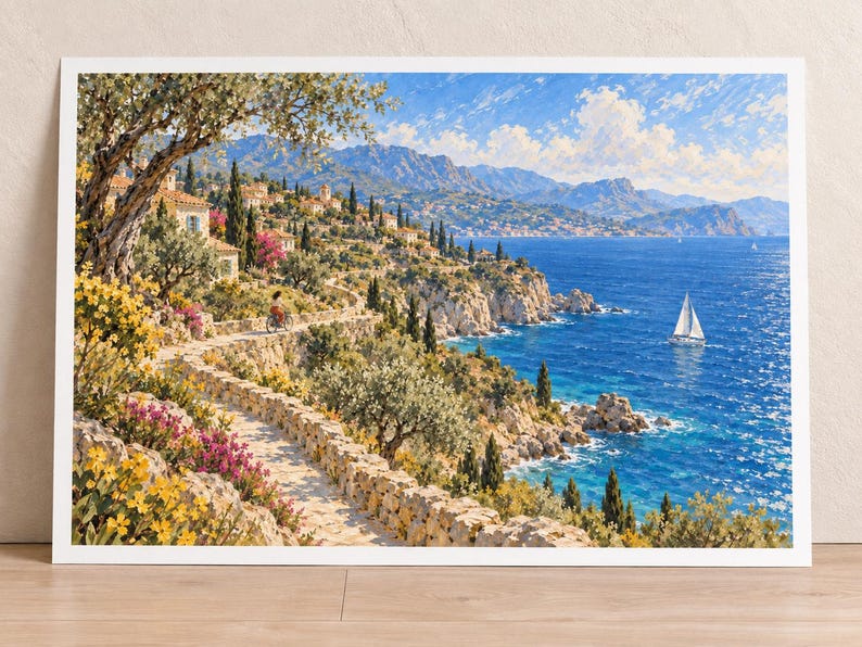 May include: A landscape art print depicting a Mediterranean coastal scene with a stone path winding along cliffs, vibrant yellow and pink flowers, olive trees, a person on a bicycle, stone houses, and a sailboat on the deep blue sea under a bright sky.