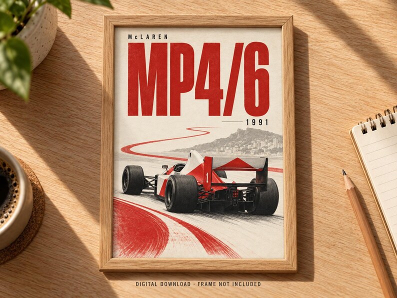 May include: A framed poster featuring a red and white McLaren MP4/6 Formula 1 race car from 1991. The artwork displays the car on a track with a red painted path, a mountain backdrop, and the bold red text McLaren MP4/6 1991 at the top.