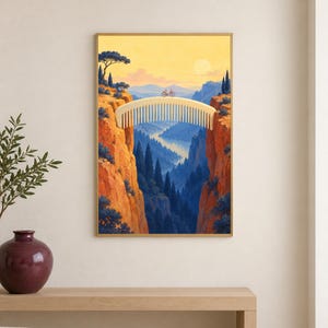 May include: A surreal art print depicting a large, cream-colored hair comb spanning a deep canyon as a bridge. A small bicycle sits on the comb. The landscape features orange cliffs, dark blue pine trees, a winding river, and a soft yellow sky.