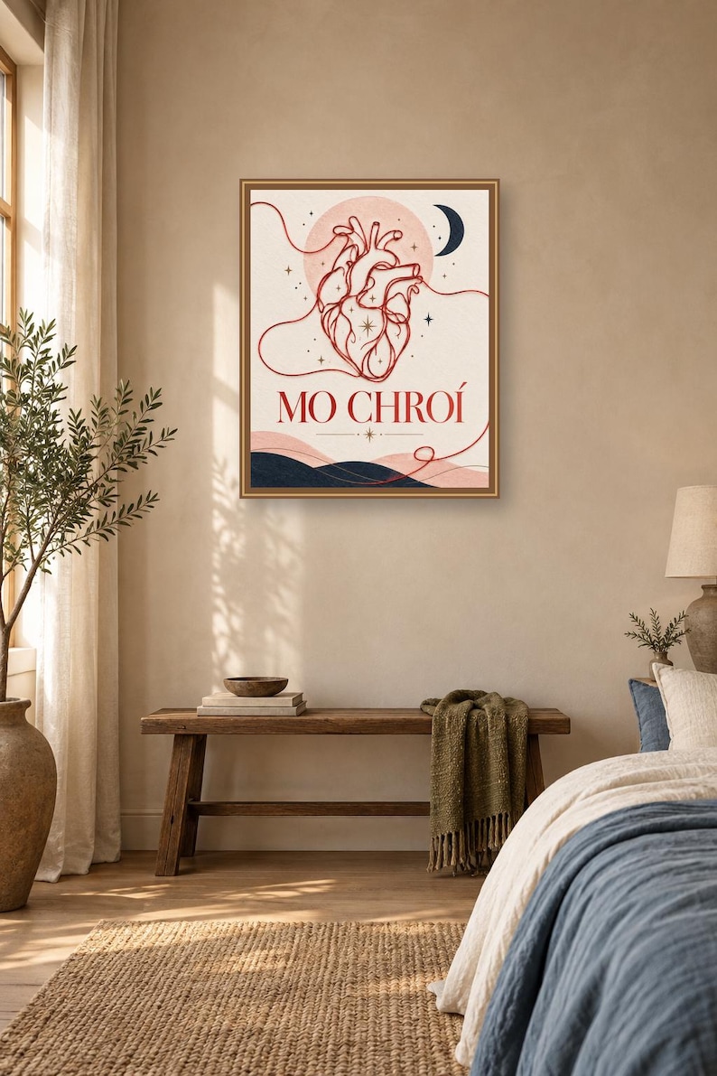 May include: A rectangular wall art print in a brown frame featuring a red line-art anatomical heart illustration, a dark blue crescent moon, and the text MO CHRO&Iacute; in red lettering, set against a cream background with dark blue abstract hills.