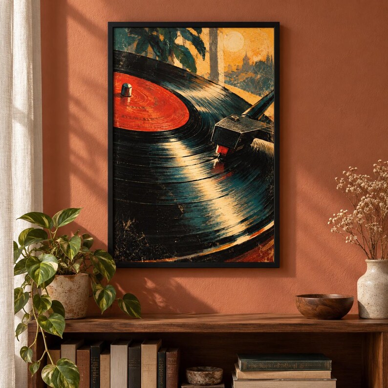May include: A framed wall art print featuring a close-up illustration of a black vinyl record spinning on a turntable. The record has a bright red center label. The artwork uses warm yellow and orange tones in the background to depict a sunset scene.