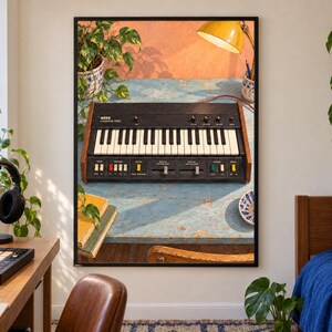 May include: A framed wall art print featuring a Korg MS-20 synthesizer on a weathered blue table. The synthesizer has a black control panel, white and black keys, and wood-grain side panels. The print is displayed in a room with a desk, plants, and a bed.