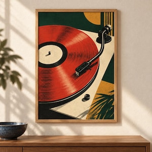 May include: A framed wall art print featuring a stylized illustration of a record player with a vibrant red vinyl record. The composition includes geometric shapes in dark green and yellow, with a black tonearm resting on the record surface.