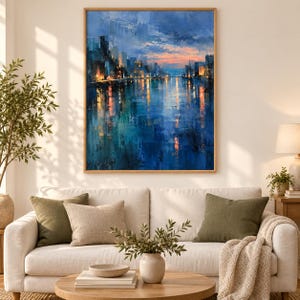 May include: A rectangular wall art painting depicting a city skyline at twilight with deep blue and teal tones reflecting on water, featuring warm orange and yellow light accents from buildings against a soft sunset sky with visible brushstrokes.