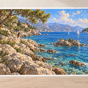 May include: A rectangular landscape painting featuring a rocky Mediterranean coastline with a person sitting on the shore, pine trees, distant villas, and sailboats on a bright blue sea under a sky filled with white clouds and warm sunlight.